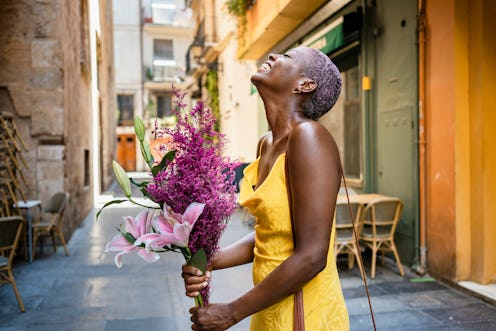 woman happy with a bouquet of flowers 