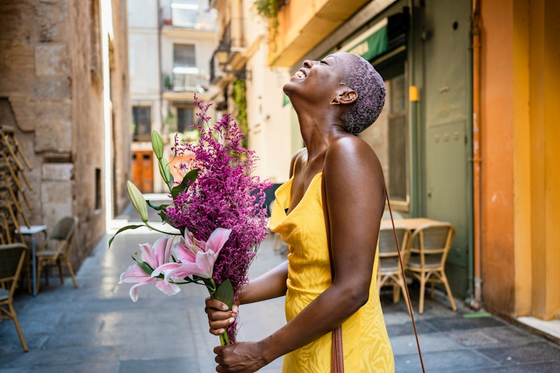 woman happy with a bouquet of flowers 