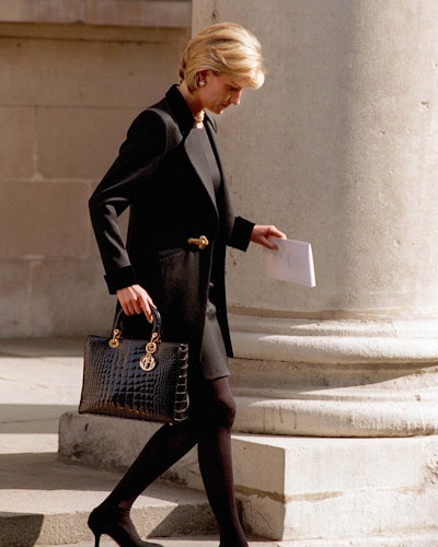 Princess Diana carries a black Lady Dior bag while leaving St. George's Church In Hanover Square, Lo...