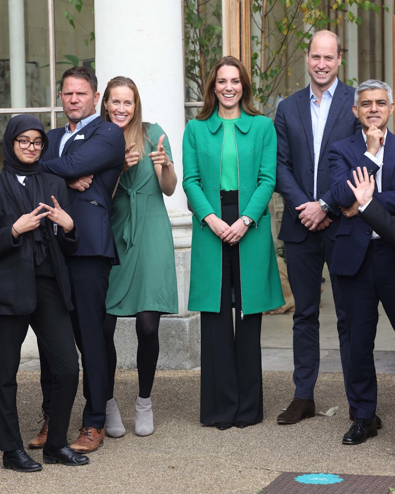 Kate Middleton wears green Zara Basic short sleeve sweater and Erdem Allie green coat on October 13,...