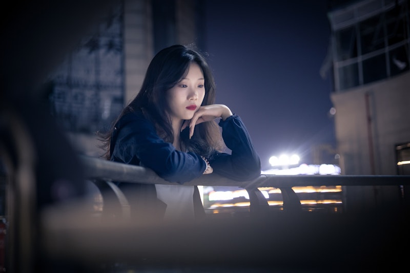 Depressed girl at night street