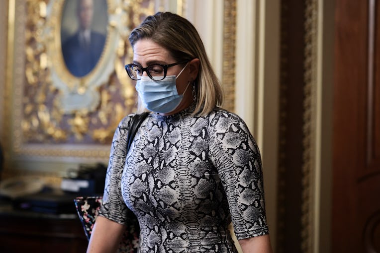 WASHINGTON, DC - OCTOBER 06: Sen. Kyrsten Sinema (D-AZ) departs from a caucus meeting with Democrati...