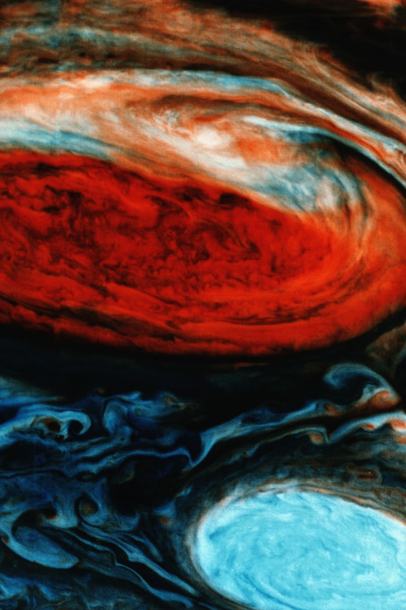 The Great Red Spot in false color. At lower right is one of the White Ovals which chase the red spot...