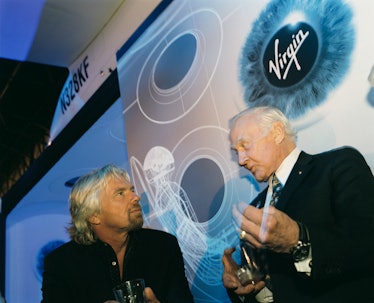 Virgin boss Sir Richard Branson and former Apollo (11) astronaut Buzz Aldrin chat after Virgin Galac...