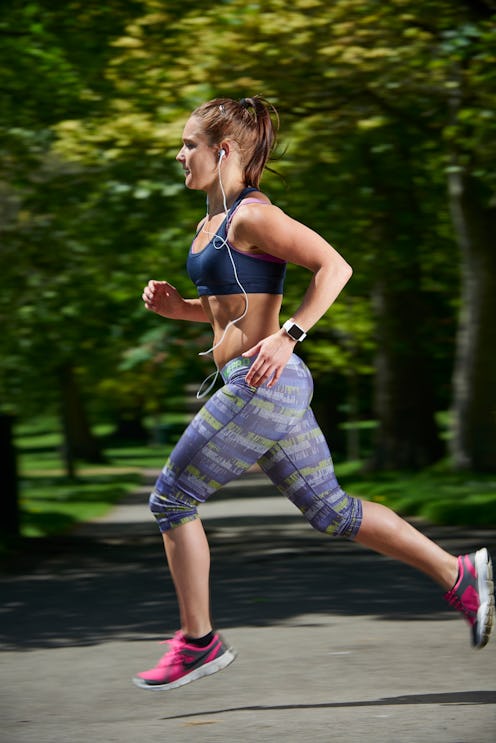 A woman runs while her Apple Watch tracks her workout and heart rate. All the health trackers on you...