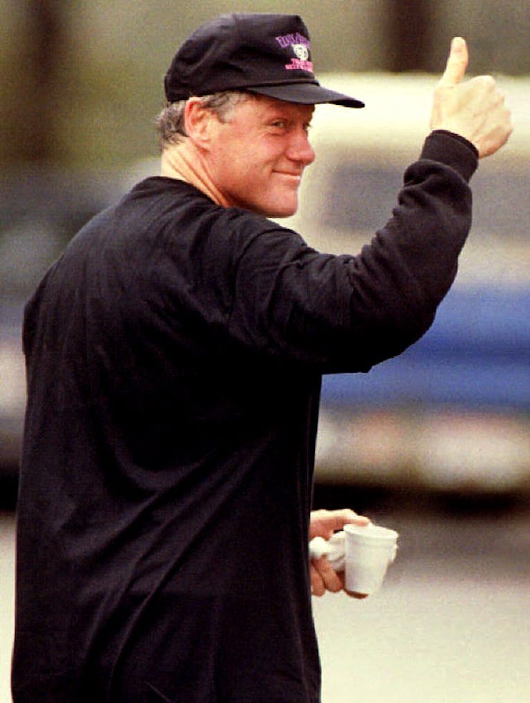 U.S. President-elect Bill Clinton reacts to onlookers' cheers 11 January, 1993 in Little Rock, AR. C...