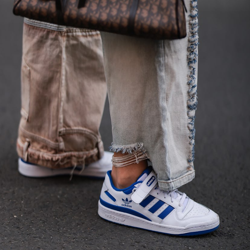 Celine Bethmann wearing blue and white Adidas Forum sneakers.