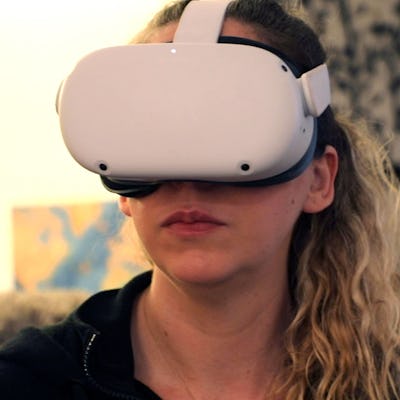 Amy Erdt, a community leader in the virtual reality space, sits in her living room and travels to fo...