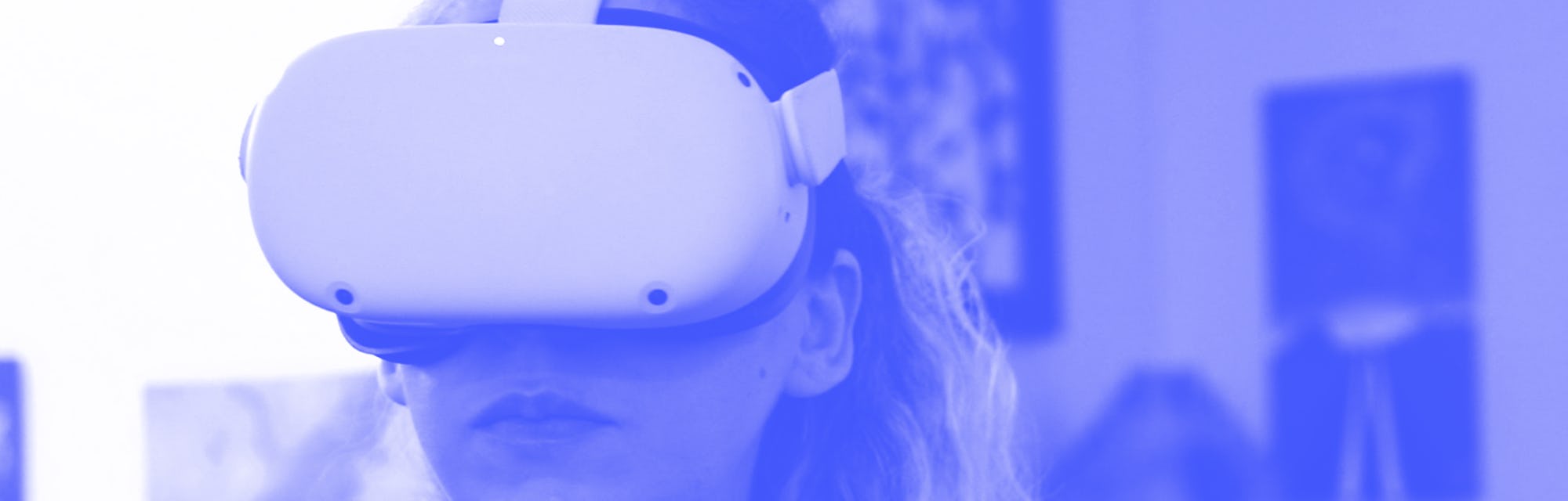 Amy Erdt, a community leader in the virtual reality space, sits in her living room and travels to fo...