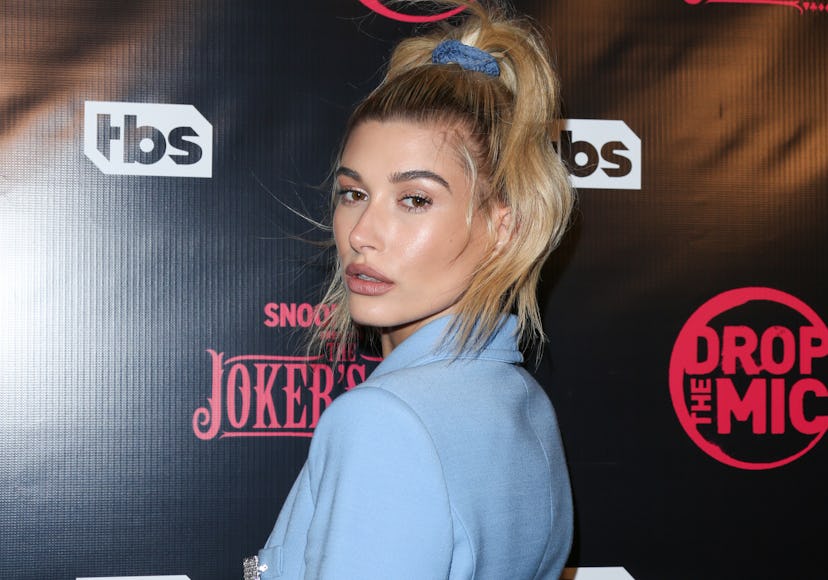 Hailey Baldwin wears a ponytail styled in a scrunchie at the premiere for TBS's "Drop The Mic" and "...