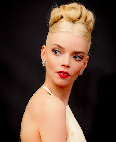 Taylor-Joy at Emmys wearing Dior Haute Couture dress with a prom-worthy updo and a statement red lip