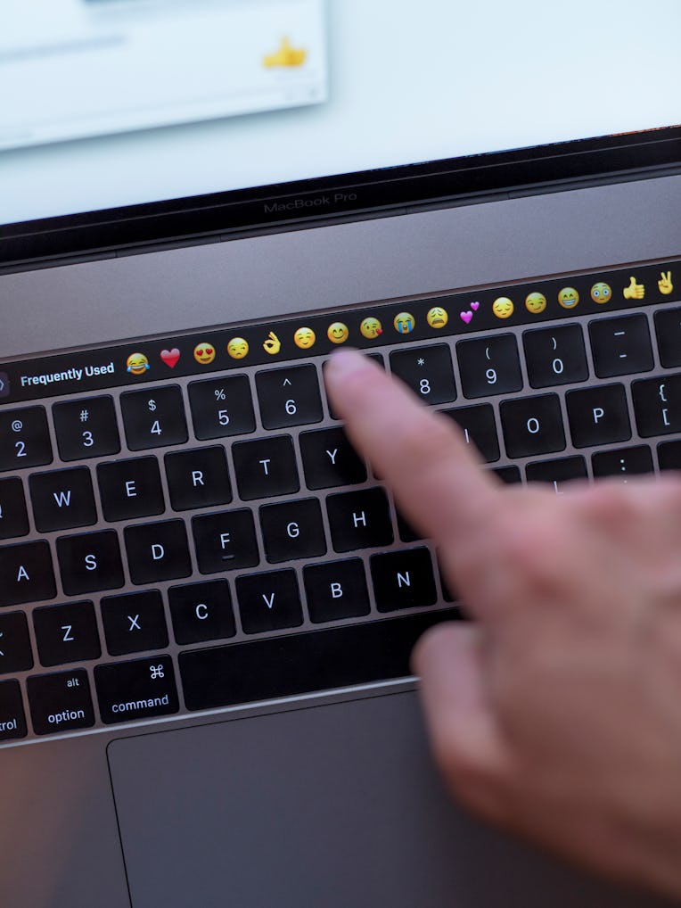 Gothenburg, Sweden - November 30, 2016: Close-up of a mans hand using the touch sensitive bar of the...