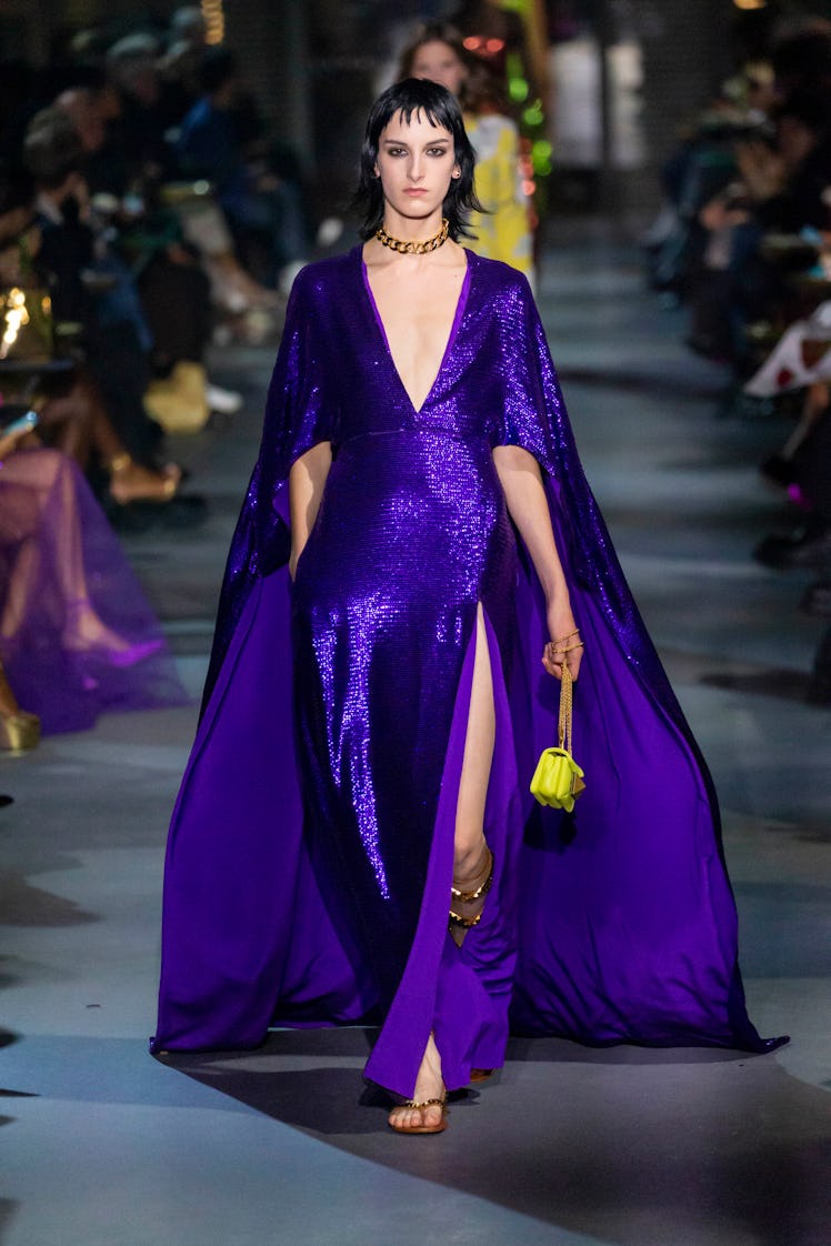 A model walking in a blue sequin dress at the Valentino Ready to Wear Spring/Summer 2022 fashion sho...