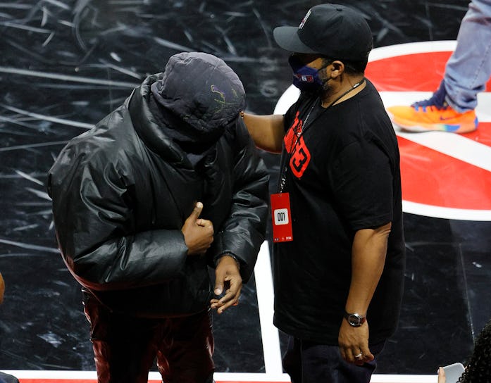 LAS VEGAS, NEVADA - JULY 17:  Rapper Kanye West (L) and BIG3 Co-Founder Ice Cube talk after a game b...