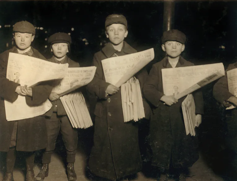 Four Young Newsboys Selling Newspapers at Hudson Tunnel Station, Jersey City, New Jersey, USA, circa...
