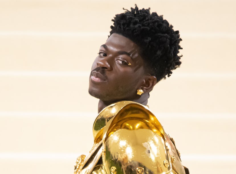 Lil Nas X thanked fans for getting "Industry Baby" to No. 1 on the charts from the top of a bus. 