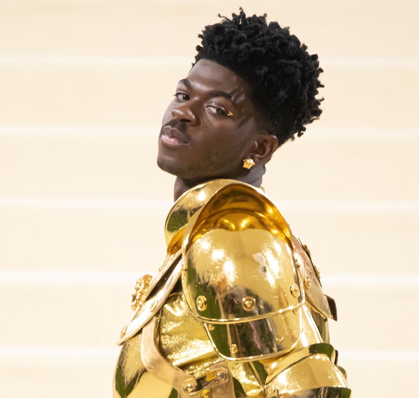 Lil Nas X thanked fans for getting "Industry Baby" to No. 1 on the charts from the top of a bus.