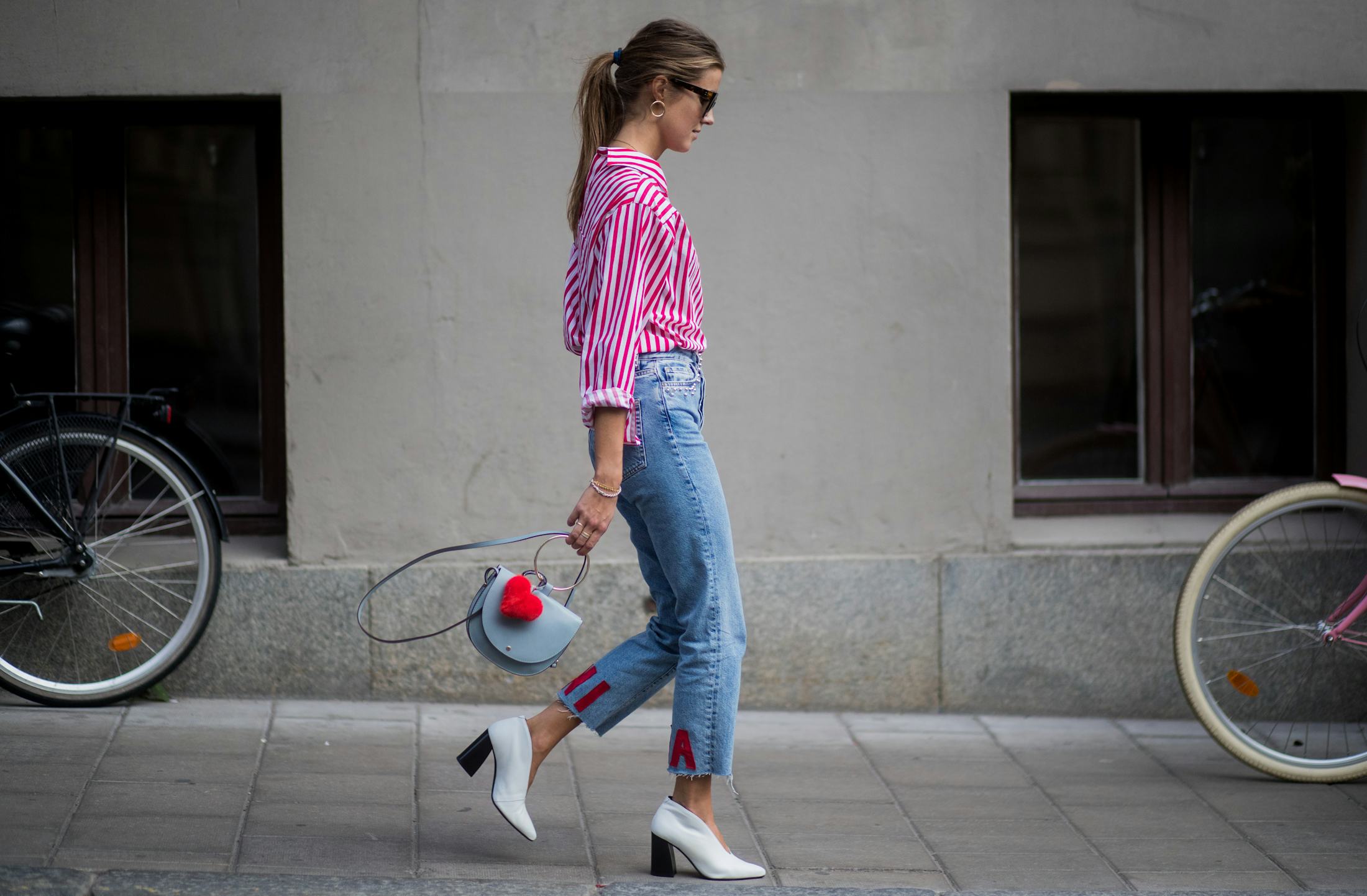 Do Jeans Shrink In The Dryer? How To Dry Jeans, According To Experts