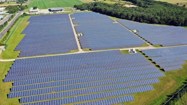 CALVERTON, NEW YORK - SEPTEMBER 19: An aerial view of solar panels at the Sutter Greenworks Solar Si...