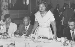 Mamie Bradley, mother of lynched teenager Emmett Till, stands with her father John Carson (left) and...