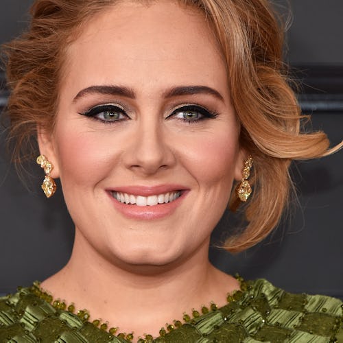 Adele in a green dress at the 59th Grammy Awards. 