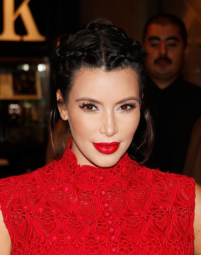 Kardashian's makeup and hair evolution: In 2013, she rocked a braided updo and bold red lip.