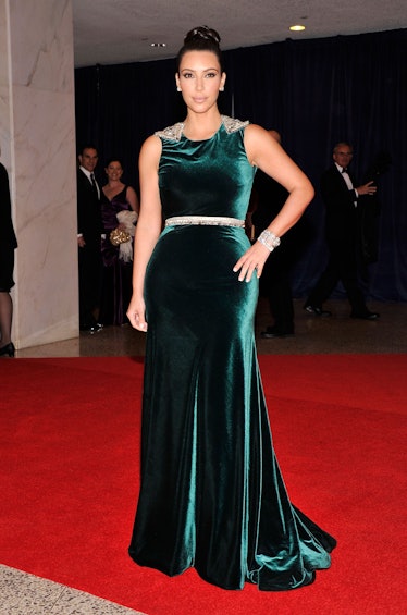 Kim Kardashian at the 98th Annual White House Correspondents' Association Dinner in a green velvet g...