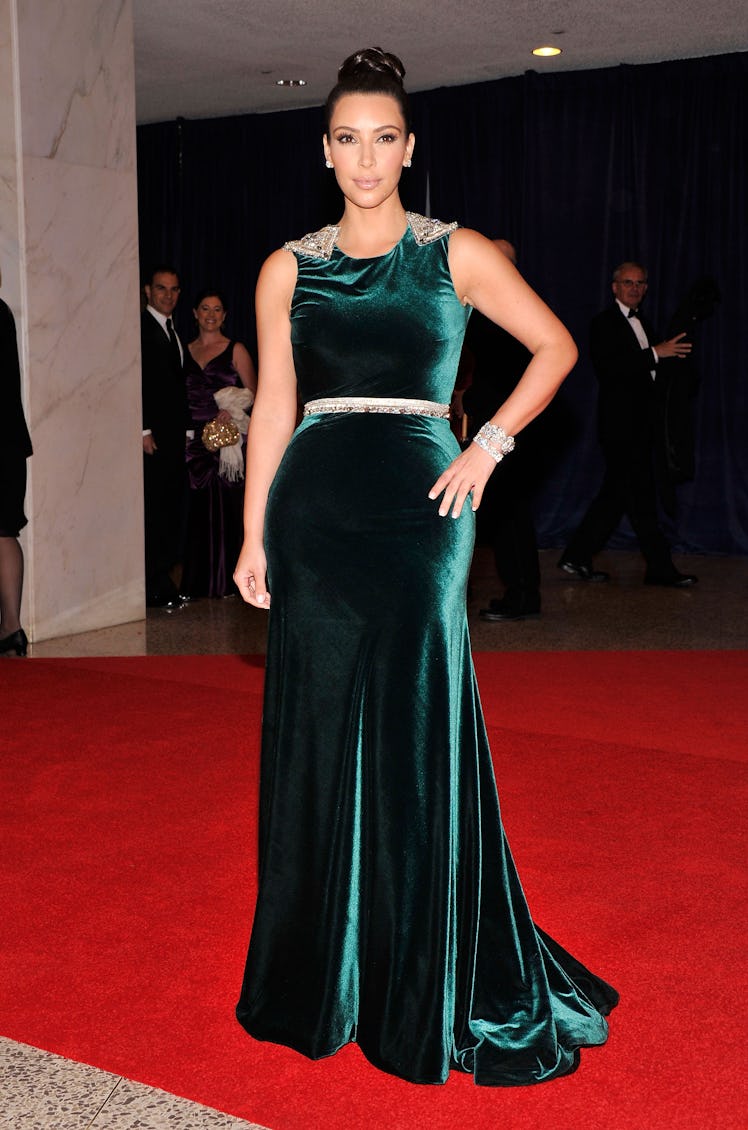 Kim Kardashian at the 98th Annual White House Correspondents' Association Dinner in a green velvet g...
