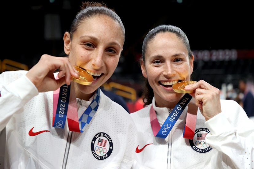 Sue Bird and Diana Taurasi with gold medals from the 2020 Tokyo Olympics.