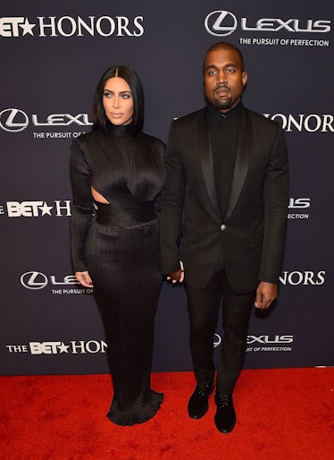 Kim Kardashian in a black gown Kanye West in a black suit at The BET Honors 2015