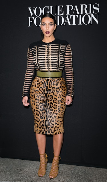 Kim Kardashian attends the Vogue Foundation Gala in a striped top and leopard-print skirt 