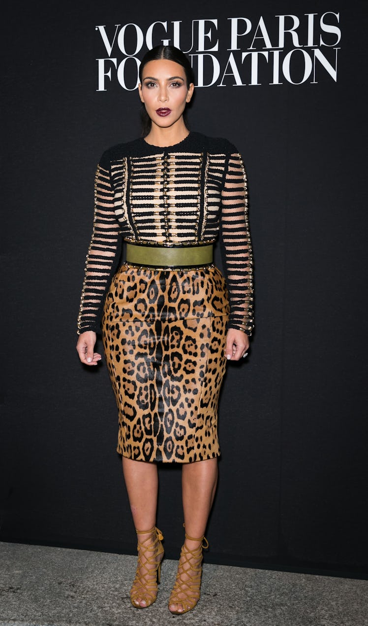 Kim Kardashian attends the Vogue Foundation Gala in a striped top and leopard-print skirt 
