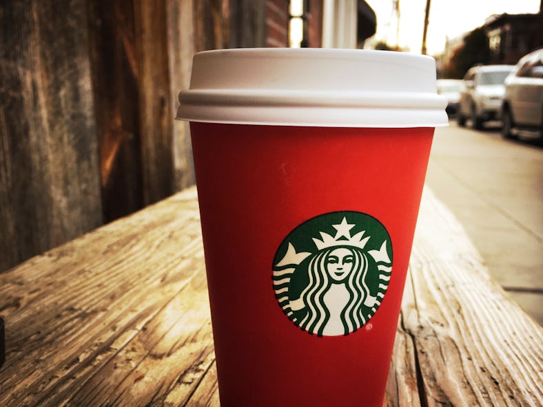Starbucks' holiday tumblers and cups for 2021 include jeweled tones and bling options.
