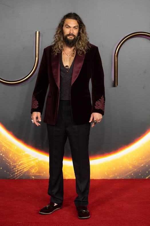 Jason Momoa in a burgundy velvet suit at the 'Dune' London premiere. (Photo by Samir Hussein/WireIma...