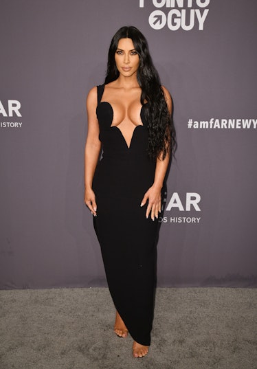  Kim Kardashian West at the amfAR New York Gala 2019 in a black gown with a plunging neckline 