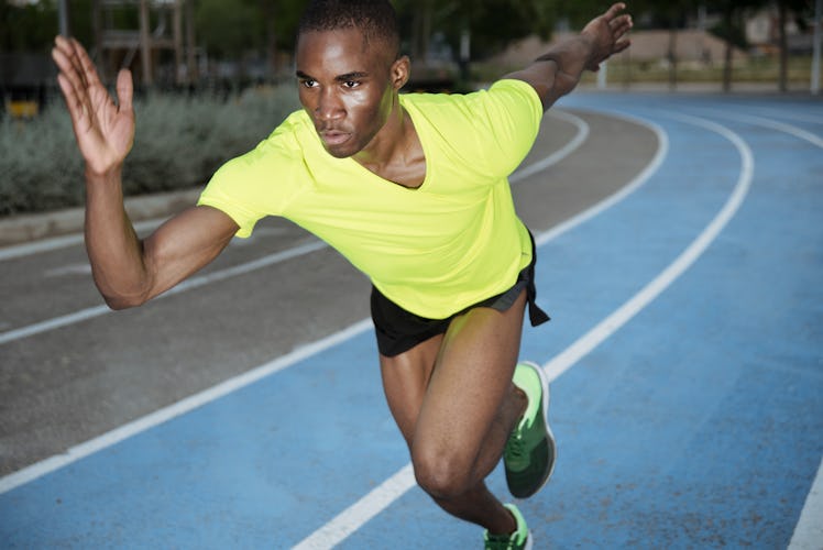 black man sprinting on a track
