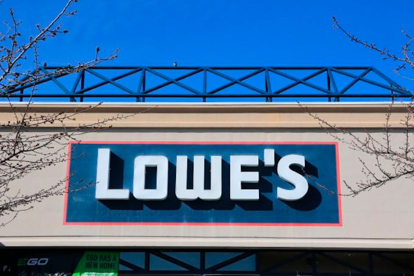 LoweÍs entrance sign above main entry doors into store, Spokane Valley, Washington with stores in th...