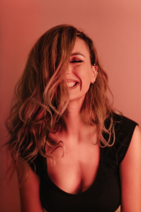 Front view portrait of a beautiful young woman smiling