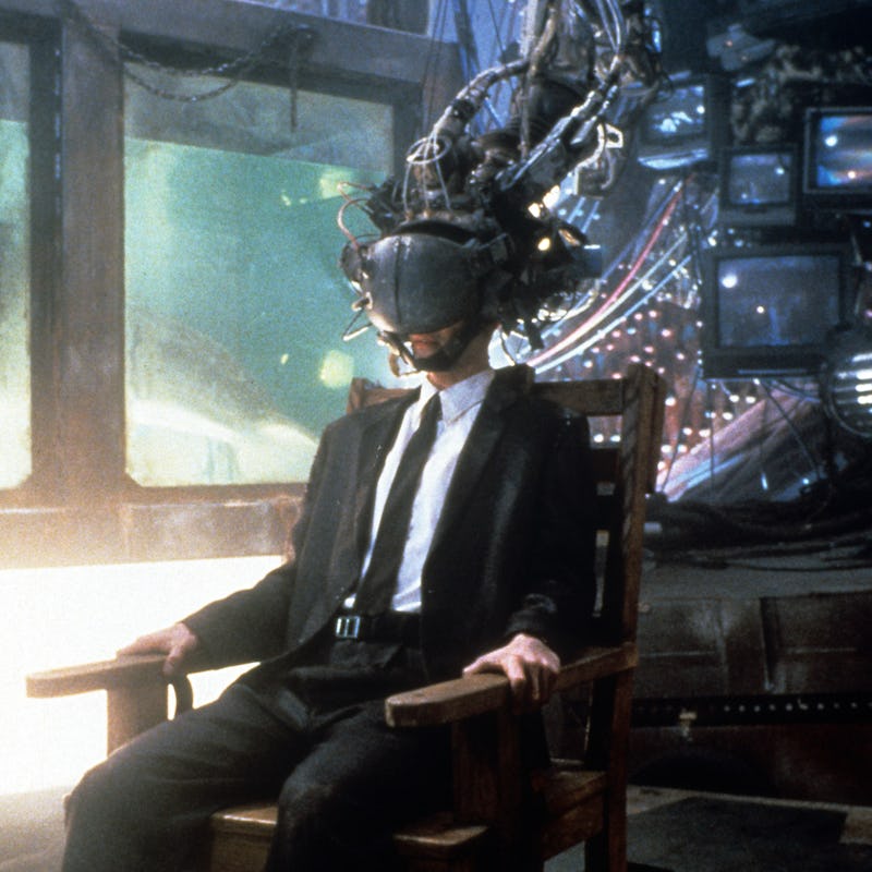 Keanu Reeves wears a device on his head in a scene from the film 'Johnny Mnemonic', 1995. (Photo by ...