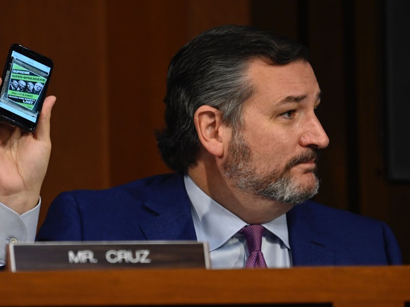 Senator Ted Cruz (R-TX) holds up a cellphone during the confirmation for Supreme Court nominee Judge...