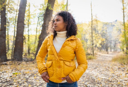 A woman walks in the woods. Ophiuchus' biggest personality weaknesses include a jealous streak.