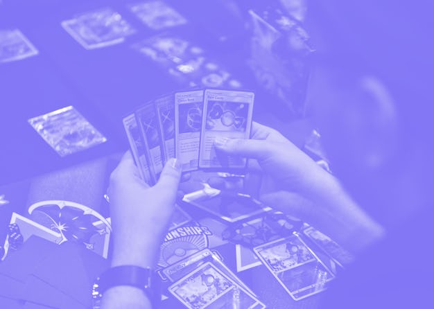 LONDON, ENGLAND - NOVEMBER 17: A competitor checks their hand at the Pokemon European International...