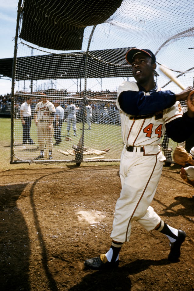 BRADENTON, FL - MARCH, 1958: Hank Aaron #44 of the Milwaukee Braves swings at the pitch during an ML...