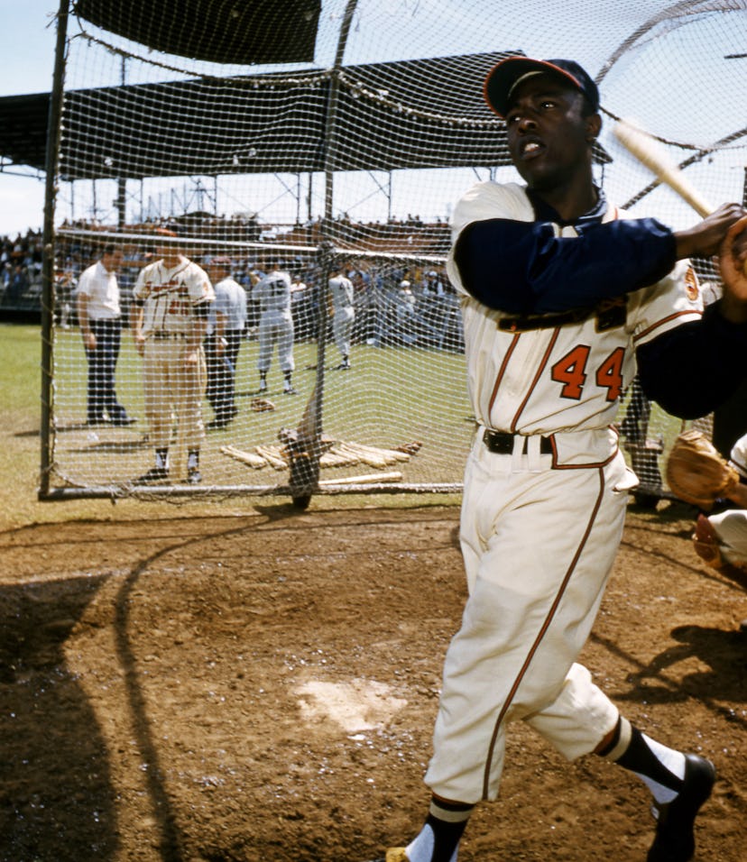 BRADENTON, FL - MARCH, 1958: Hank Aaron #44 of the Milwaukee Braves swings at the pitch during an ML...