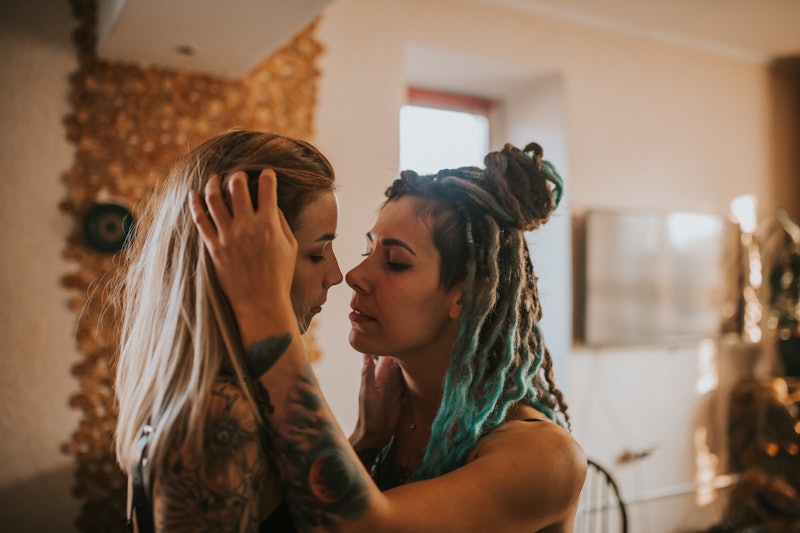 A lesbian couple prepares to kiss inside. Scorpio season 2021 will supercharge each sign's love life...