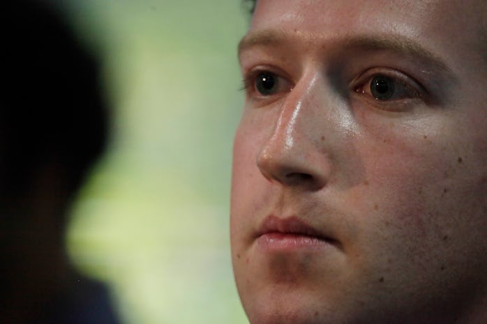 Facebook CEO Mark Zuckerberg listens to a questions while speaking during a press conference at Face...