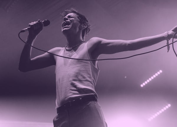 Mike Hadreas of Perfume Genius performing at FYF Fest in a white tank top 