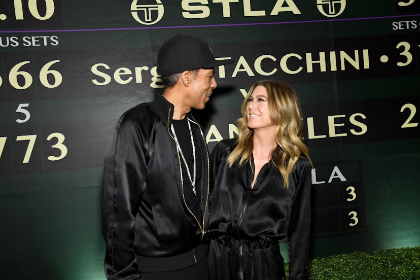 Ellen Pompeo and Chris Ivery smile at each other at the Sergio Tacchini STLA Launch in 2019. 