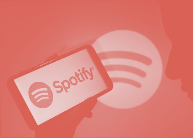 This illustration photo shows the logo of Spotify on a smartphone in Tehatta, West Bengal, India, on...