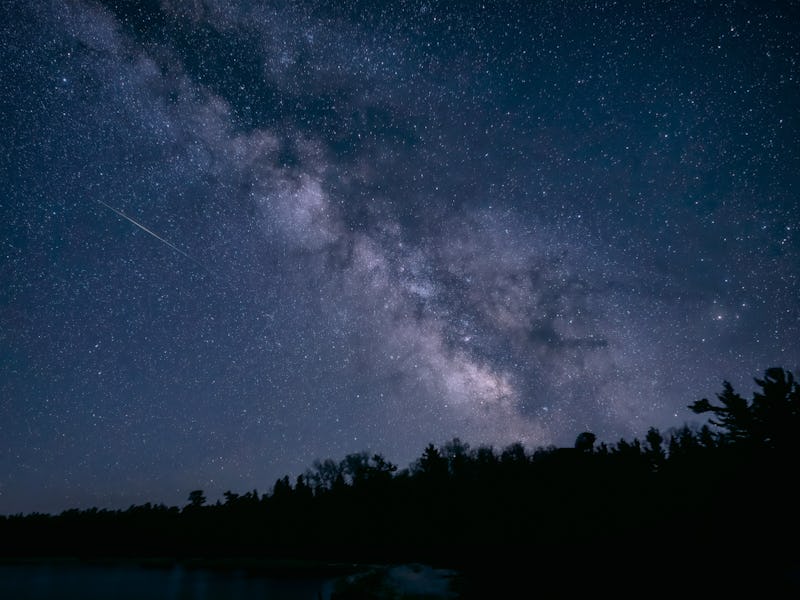 A meteor and the Milky Way over Lake Michigan in Wilderness State Park. Wilderness State Park prese...